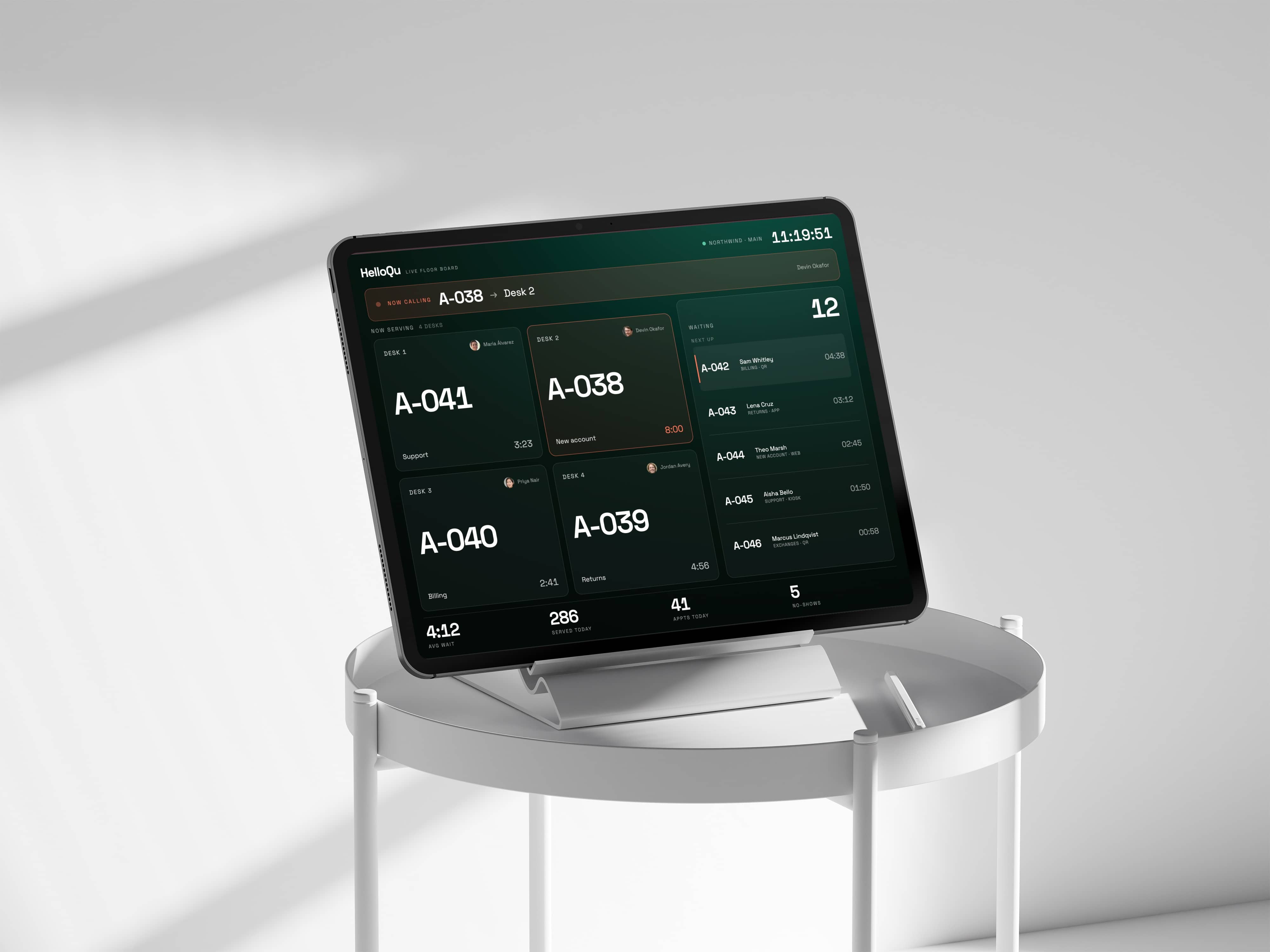 HelloQu live floor board — now calling A-038 to Desk 2, with the waiting list